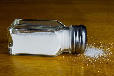 spilled salyt on a tableの写真素材