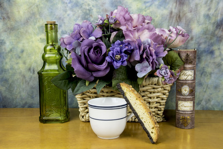 biscotti with tea cup andassorted flowers,の写真素材
