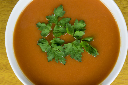 tomato soup with parsleyの写真素材