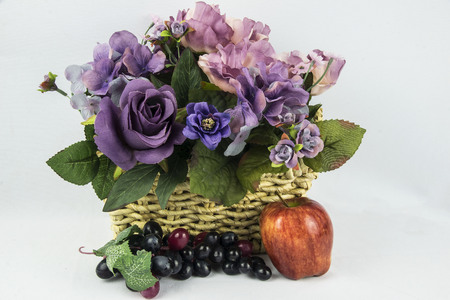 assorted flowers with a apple and grapes,の写真素材