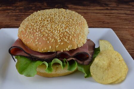 roast beef on a bun with chipsの写真素材