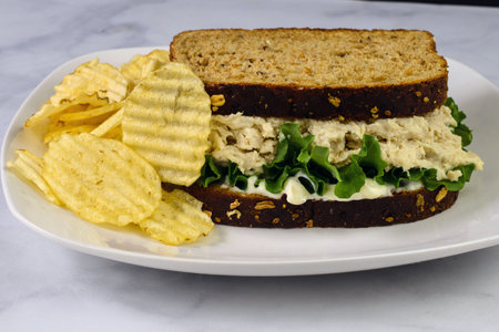 chicken salad  with lettuce between whole wheat bread,の写真素材