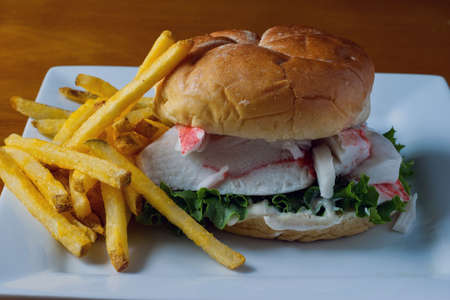 crab meat on a bun with lettuce and mayonnaise.の写真素材