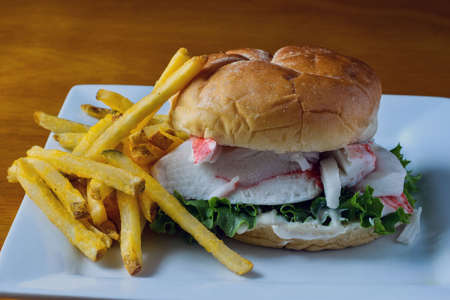 crab meat on a bun with lettuce and mayonnaise.の写真素材
