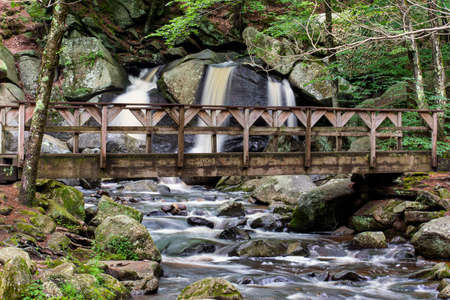 a bridge crossing a brook at  trap falls in townsend ma.の写真素材