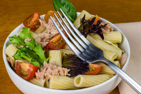 pasta cnsisting  of ziti, tomatoes  and leafy greens,の写真素材