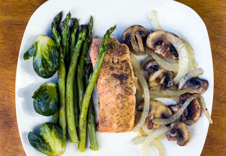baked season salmon with sauteed onions and mushroomsの写真素材