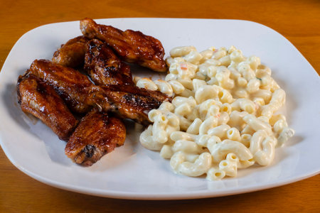 honey barbecue wings  served with macaroni saladの写真素材