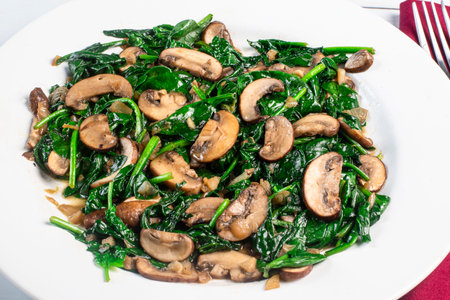 dish of sauteed  spinach and sauteed mushrooms,の写真素材