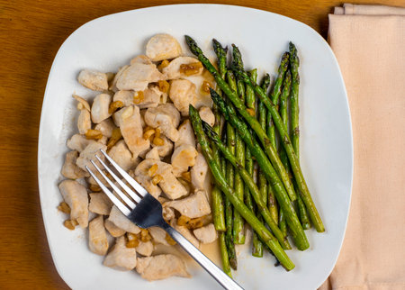 chicken bites top with onions and served  with asparagus,の写真素材