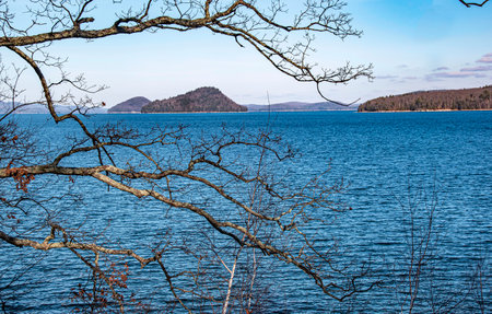 the  quabbin reservoir  in ware massachusetts seen through  the treesの写真素材