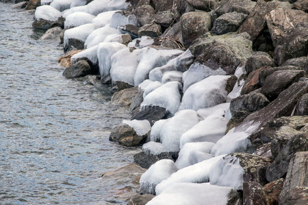 ice covered rocks along the quabbin reservior in ware massachusetts