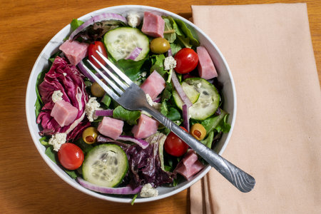ham salad  with mixed greens , olives and onions,.の写真素材