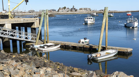 boats sitting idle  at the new hampshire sea coast on a spring day,の写真素材