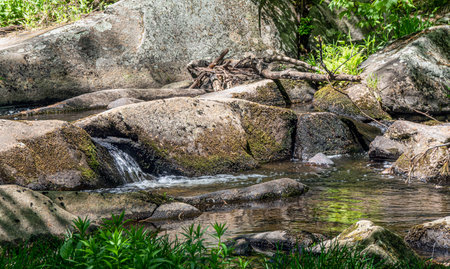 water cascading  of rocks  in willard brook in  willard brook state forest in ashby massachusettsの写真素材
