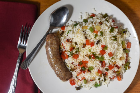 italian sausage  with rice top with sauteed peppers and onionsの写真素材
