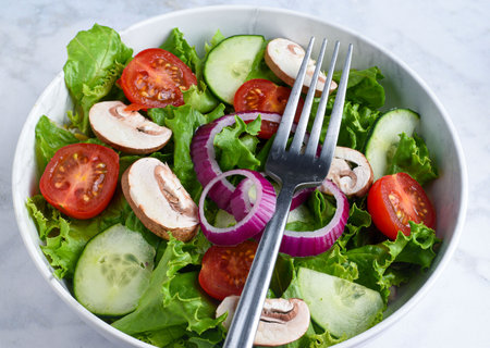 garden salad consising  of  bacon, mushrooms tomatoes and cucumbers,の写真素材