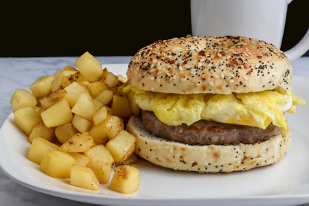 sausage and scramble egg breakfast sandwich with hash browns,の写真素材