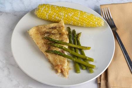 baked cod  served with  asparagus and cor, ,の写真素材