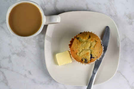 blueberry muffin  served with a fresh cup of coffeeの写真素材