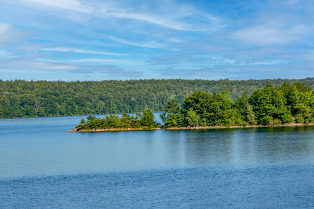 a small penninsulasurrounded by the water of the  quabbin reservoirの写真素材