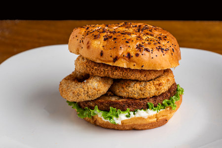 plant based burger top with veggie rings on a everything  brioche bun,の写真素材