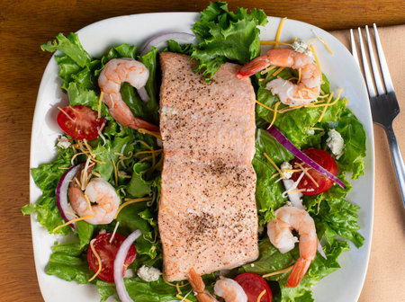 baked season salmon served on a salad,の写真素材