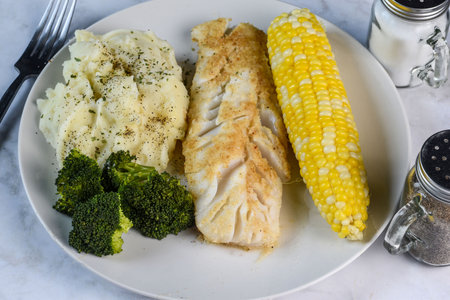 baked cod  served with  asparagus and cor, ,の写真素材