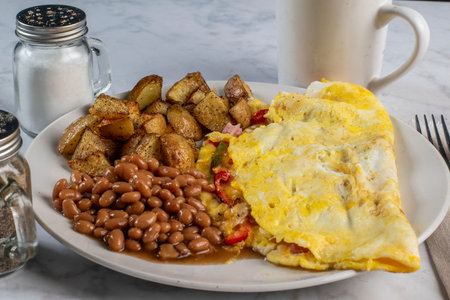 wester omelet served with baked beans and homefries