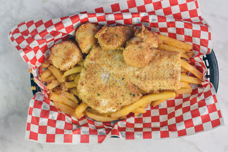 baked haddock, served with scallops and a side of fries