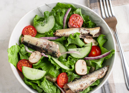 garden salad  with  nmushrooms and sardinesの写真素材