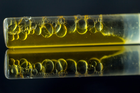 Medical Oil Cannabis - marijuana flower and oil cannabis on the mirror black background.の写真素材