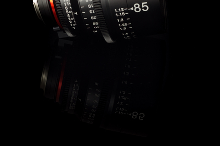 Professional Cinema Lens - camera lenses on the mirroring black background.の写真素材