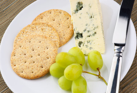 Blue cheese biscuits and grapesの写真素材