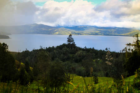 Field next to La Cocha Lagoon - Colombia. To the surroundings of La Cocha Lagoon, El Encano - Narino, Colombia. This image shows the field and the pond.の写真素材