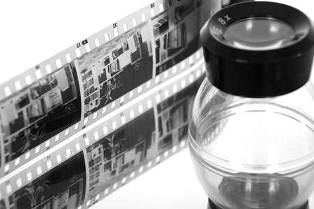 A strip of film negative and loupeの写真素材
