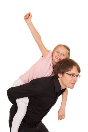Father giving piggyback ride to his daughter which raises her hand to the sky. Isolated on white background.の写真素材