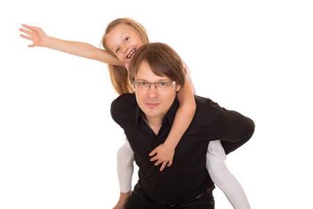 Man giving piggyback ride to a little girl which raises her hand to the sky. Isolated on white background.の写真素材