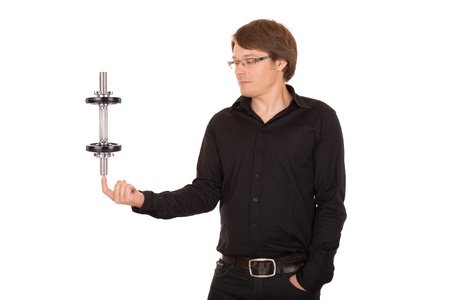 Business man juggling with dumbbell on a finger. Isolated on white background.の写真素材