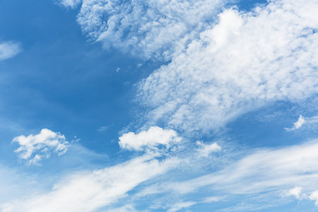 blue sky background with tiny clouds