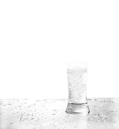 water in glass with reflectionの写真素材