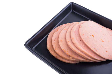 Bologna sausage with ham (vegetarian) on a plateの写真素材