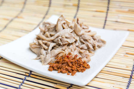 steamed thai mushroom, steamed mushrooms on dish with ingredient of thai spicyの写真素材