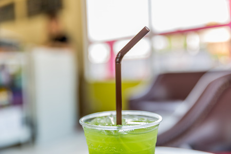 kiwi juice, fresh kiwi juice in plastic cupsの写真素材