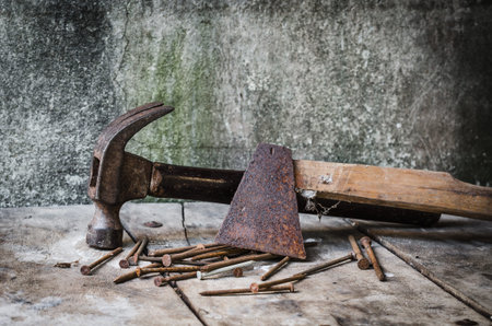 Construction tools,Old rusty axe and old nail claw hammerの写真素材