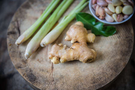 Still-life with ginger on wood cutting boardの写真素材