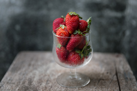 A glass containing strawberriesの写真素材