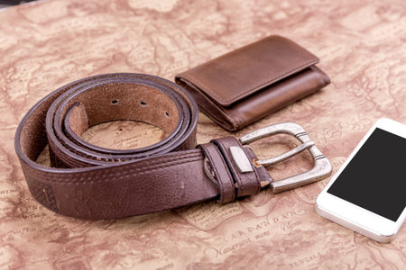 concept of traveling all over the world with mobile phone, belt,wallet