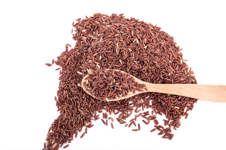 Jasmine Brown Rice in a wooden spoon close-upの写真素材