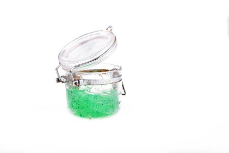 Gel for care of the face in a glass jar. Isolation on white backgroundの写真素材